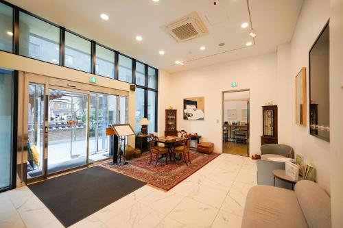 a living room with a table and chairs at Hotel DADA Insadong in Seoul