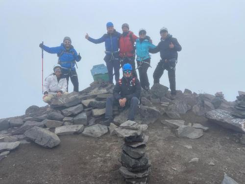 a group of people standing on top of a mountain at Ilinizas Wasi Hospedaje in Machachi
