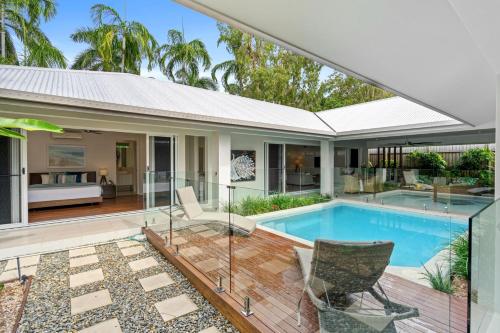 an image of a house with a swimming pool at Belle Escapes - Namaste, Oasis in Palm Cove in Palm Cove