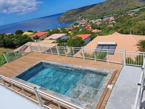 Hồ bơi trong/gần Maison de 2 chambres avec piscine partagee et wifi a Les Anses d'Arlet a 5 km de la plage