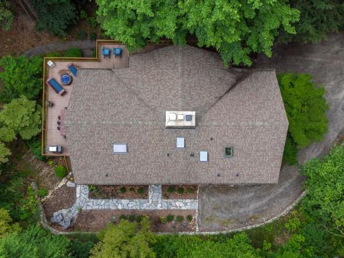 an overhead view of a house with a roof at Retro Metro Deck House MCM Gem with Hot Tub & Spectacular Views! in Fairview