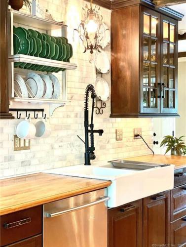 a kitchen with a sink and a counter at The Connecticut River Valley Inn Hartford South/Glastonbury in Glastonbury