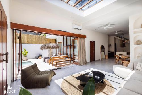a living room with a couch and a table at Beach Villas Canggu 300m from Echo Beach in Canggu
