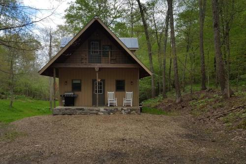 a small house in the middle of the woods at Mohican area secluded 2 bedroom cabin in Loudonville