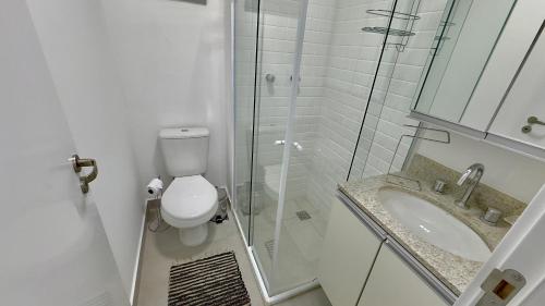 a bathroom with a toilet and a sink and a shower at 056 - Rentaqui Apartamento Jardim Park Side in Sao Paulo
