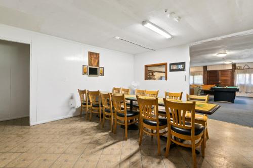 a dining room with a table and chairs at Front Lodge at Rainier Lodge (0.4 miles from entrance) in Ashford
