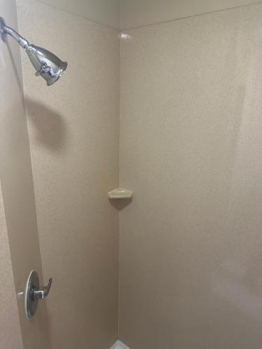 a shower with a glass door in a bathroom at Sleep Inn & Suites at Six Flags in San Antonio