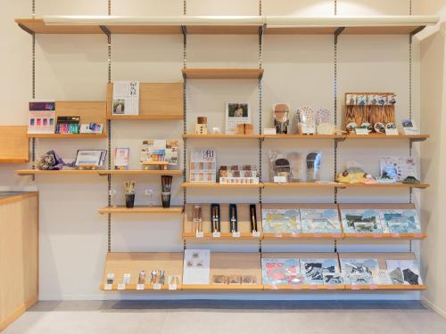 a store with shelves of products on the wall at You Style Hotel MARINE in Kagoshima
