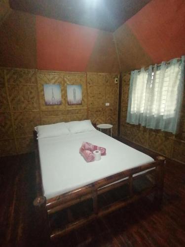 a large bed in a room with at Villa Tabitha in Panglao Island