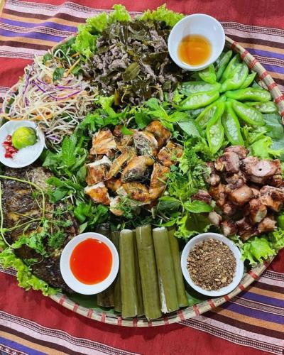 a large plate of food on a table at Mai chau Horizon Homestay in Mai Chau