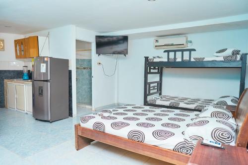 Η κουζίνα ή μικρή κουζίνα στο Habitaciones y aptos Isabella