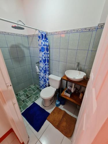 a bathroom with a toilet and a sink at Casa Naranja in Granada