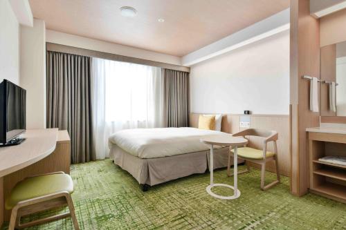 Säng eller sängar i ett rum på Vessel Hotel Kumamoto Airport