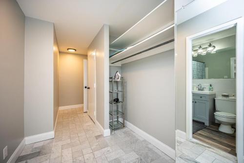 a bathroom with a toilet and a sink at Atlanta Downtown! High Rise! Onsite Parking LM609 in Atlanta