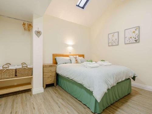 a bedroom with a large bed and a sink at 3 Bed in Whitby 90809 in Aislaby