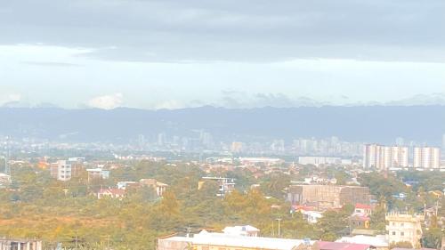 a view of a city with buildings and trees at Sea & City lights View in Lapu Lapu City