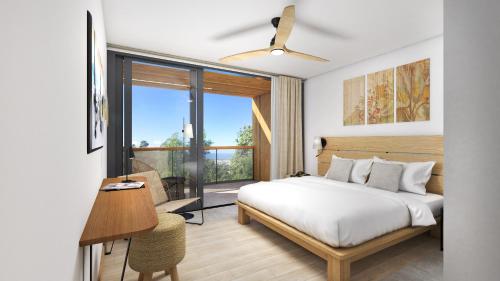 - une chambre avec un lit et une grande fenêtre dans l'établissement Papangue Hôtel & Spa, à L'Étang-Salé