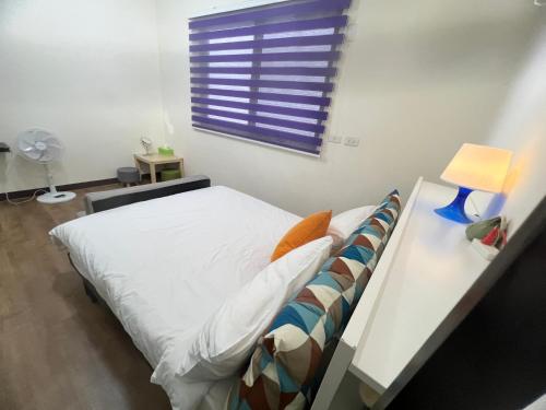Cama o camas de una habitación en 薇楽民宿
