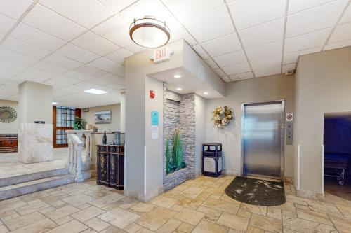 an office lobby with a exit sign and a door at Pirates Cove Unit G22 in Daytona Beach
