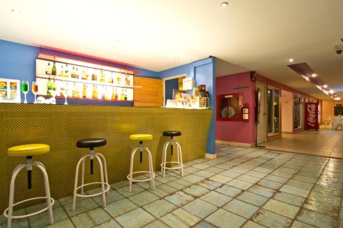a bar in a restaurant with stools at Best Bella Pattaya in Pattaya North