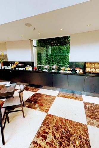 Un lugar para sentarse en Hotel GranEstanConfor Veranda Berrini - Master Deluxe Duplex - Business Excellence - king Studio - by LuXXoR