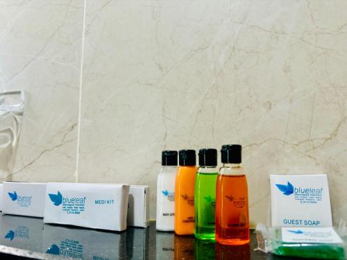 three bottles of essential oils sitting on a counter at Olive Serviced Apartments BTM Layout in Bengaluru