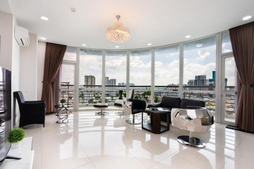 a living room with a view of a city at Tracy Ben Thanh Tower in Ho Chi Minh City