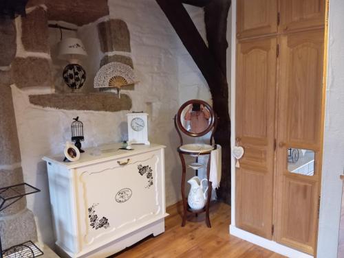 a room with a white cabinet and a door at La Gerbaudiere Chambres&Table d hotes proche Mont Saint Michel CUISINE MAISON in Notre-Dame-du-Touchet