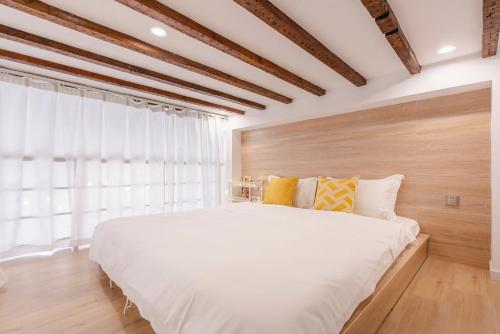 מיטה או מיטות בחדר ב-Shanghai Hills & XING 6131 Homestay