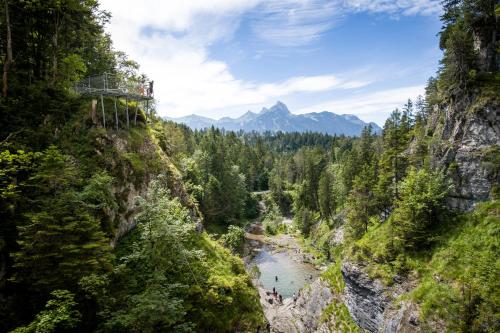 a view of a river between two mountains at Pension Kreuzeck - Dein Glücksplatz am Lech in Weissenbach am Lech