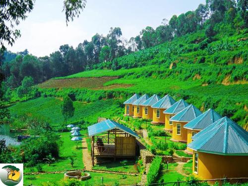 a row of houses on the side of a hill at Antique cottages in Kabale