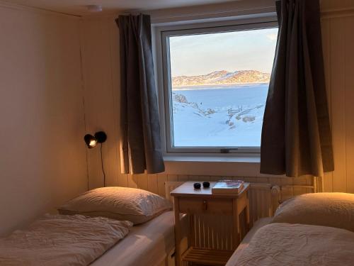 Llit o llits en una habitació de Grand seaview vacation house, Ilulissat