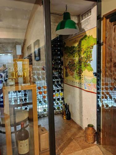 a display window of a wine shop with a map at Hotel FAMIL - adults only in Bansko