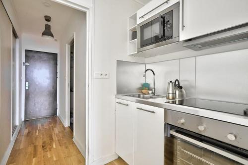 A kitchen or kitchenette at Cosy studio avec parking au sous-sol