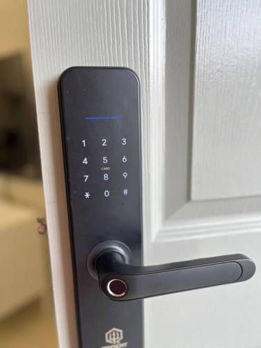 a close up of a door with a remote control at Double Seven Eight Homestay SemiD at Bandar Baru Setia Awan Perdana in Sitiawan