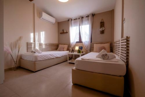 Letto o letti in una camera di Omonia Beach House 2
