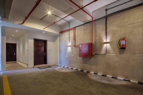 an empty room with a pay phone on the wall at Luxurious Apartment Partial Sea View in Jeddah