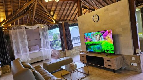 Телевизор и/или развлекательный центр в Puri Ratu Jimbaran