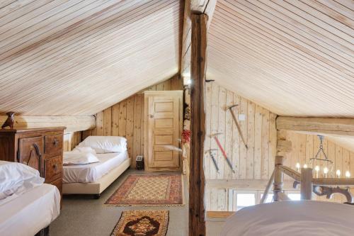 a bedroom with two beds in a attic at Chalet Spouter Happy Rentals in Chamonix