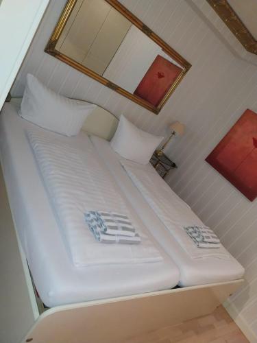 Postel nebo postele na pokoji v ubytování Ferienwohnung Strandrose