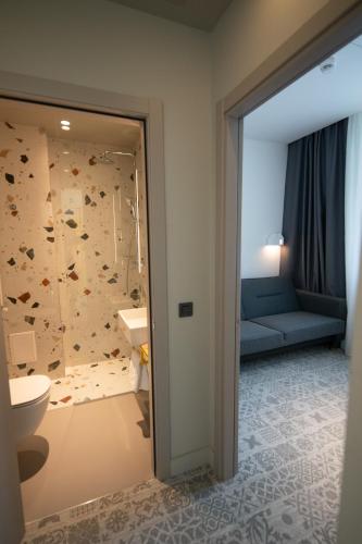 Postel nebo postele na pokoji v ubytování Ibis Styles Sibiu Arsenal