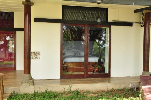 a front door of a house with a window at The Buena Vista Kandy in Kandy