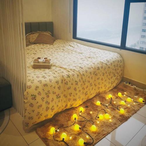 a bedroom with a bed with lemons on it at Homestay Vinhome Ocean Park S201 in Hanoi
