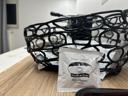 a bag of coffee sitting on top of a table at maison Frima B&B in Matera