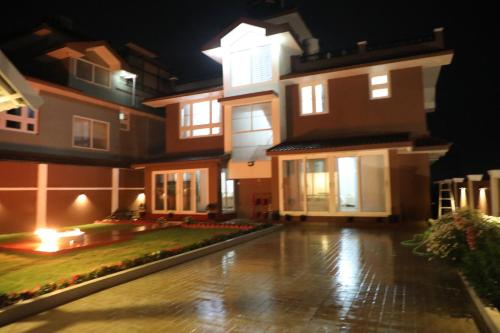 a view of a house at night at HAILSTONE HOME STAY in Ooty