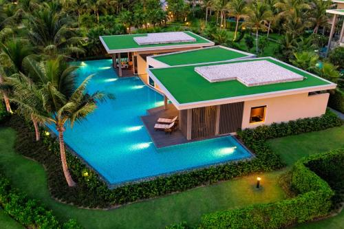 an overhead view of a house with a swimming pool at Pullman Phu Quoc Beach Resort in Phu Quoc