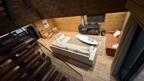 an overhead view of a living room with a couch and a fireplace at ARTYSUR LUX VILLAGE CASA 2 in Sierra Nevada