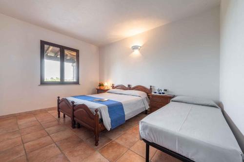 A bed or beds in a room at House and Apts. Siniscola/Sardinien 35758