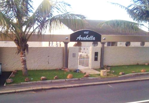 a building with a sign on the side of a street at Arabella in Durban