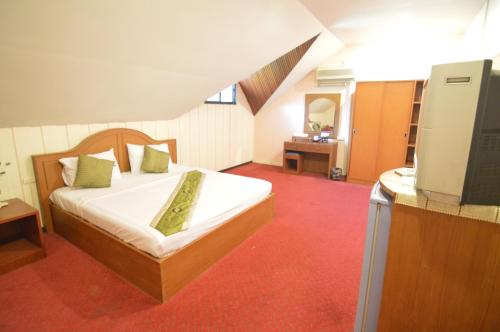 Postel nebo postele na pokoji v ubytování Techno Riverview Resort